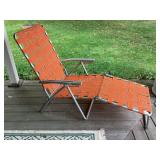 Vintage folding aluminum webbed lounger, orange