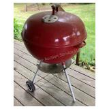 Large red Weber charcoal grill, 22x37' tall