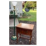 Empty sewing machine cabinet & floor lamp