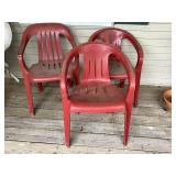 3 red stacking patio chairs, plastic