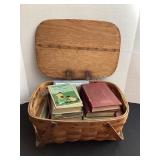 Vintage picnic basket of old books