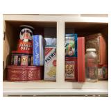 Cupboard of tins & old bottle