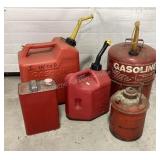 5 gas cans, small rectangular one has content