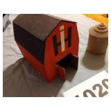 Handmade wooden barn and plastic silo