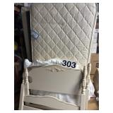 Twin sz bed frame rails and mattress.