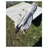 Outdoor metal patio table with umbrella