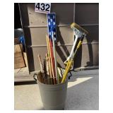 Assorted poles. Cleaning mop, umbrellas