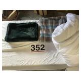 White comforter, green throw, & flannel blanket.