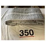 Grey quilt.