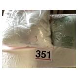 Green and white comforter.