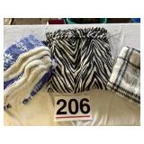 3 assorted throw blankets.