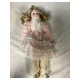 Porcelain doll. Stains on pants