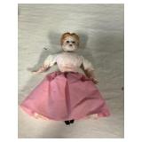 Mini porcelain doll.