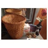Perfumes, brown glass vase, wicker waste basket,