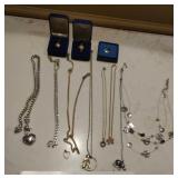 Necklaces, eye glass chains and Avon pins
