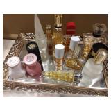 Variety of perfumes and mirrored tray