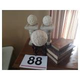 Home decor pillars, balls and storage books