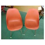 2 plastic bucket chairs