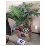 Artificial fern in wicker basket