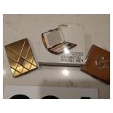 Vintage compacts and cosmetic brush set