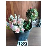 Faux flowers and large plastic pot