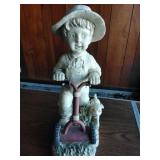 Farmer boy mowing statue