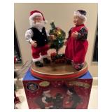 Dancing Claus couple lights up and works