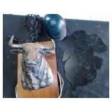 Lighted bull and blue disc and metal pig plaque