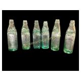 Six Green Glass Specialty Bottles