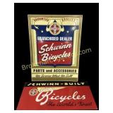 Two Schwinn Bicycle Signs