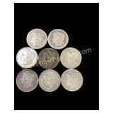 Eight Morgan Silver Dollars