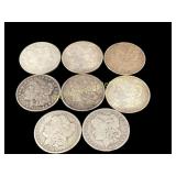 Eight Morgan Silver Dollars