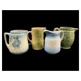 Four Pottery Pitchers