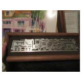 Etched cut steel of locomotive mounted and framed