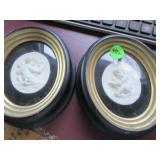 Pair molded plaster relief of Putti framed
