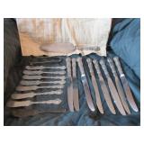 7 sterling butter knives, sterling sugar tongs,
