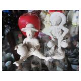 2 small clay figures of boys with jugs