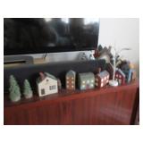 Wooden Colonial style houses, model trees