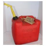 Red plastic 5 gal gas can Mostly Full