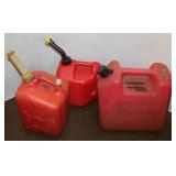 3 Red plastic Gas cans w/ gas: 5 Gal, 2.5, & 2