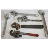 4 adjustable Wrenches and 2 pipe wrenches