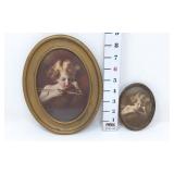 (2) 'Cupid Asleep' Oval Framed Pictures