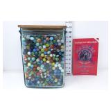 Large Assortment of Marbles in Glass Battery Jar
