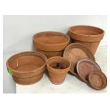 4 clay pots and 3