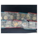 Group of mint sets that have been cut open and