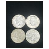 Group of 4 90% silver 1964 Kennedy half dollars