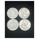 Group or 4 silver Ben Franklin half dollars