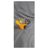 Orange and brown art glass bowl has a crack