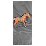 Leather horse has a damaged back leg