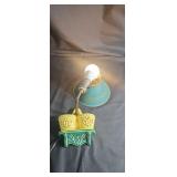 Mid century modern wall lamp with shade.